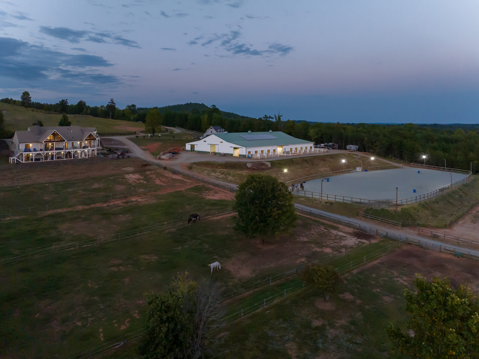 Outdoor arena at twilight with flood lights